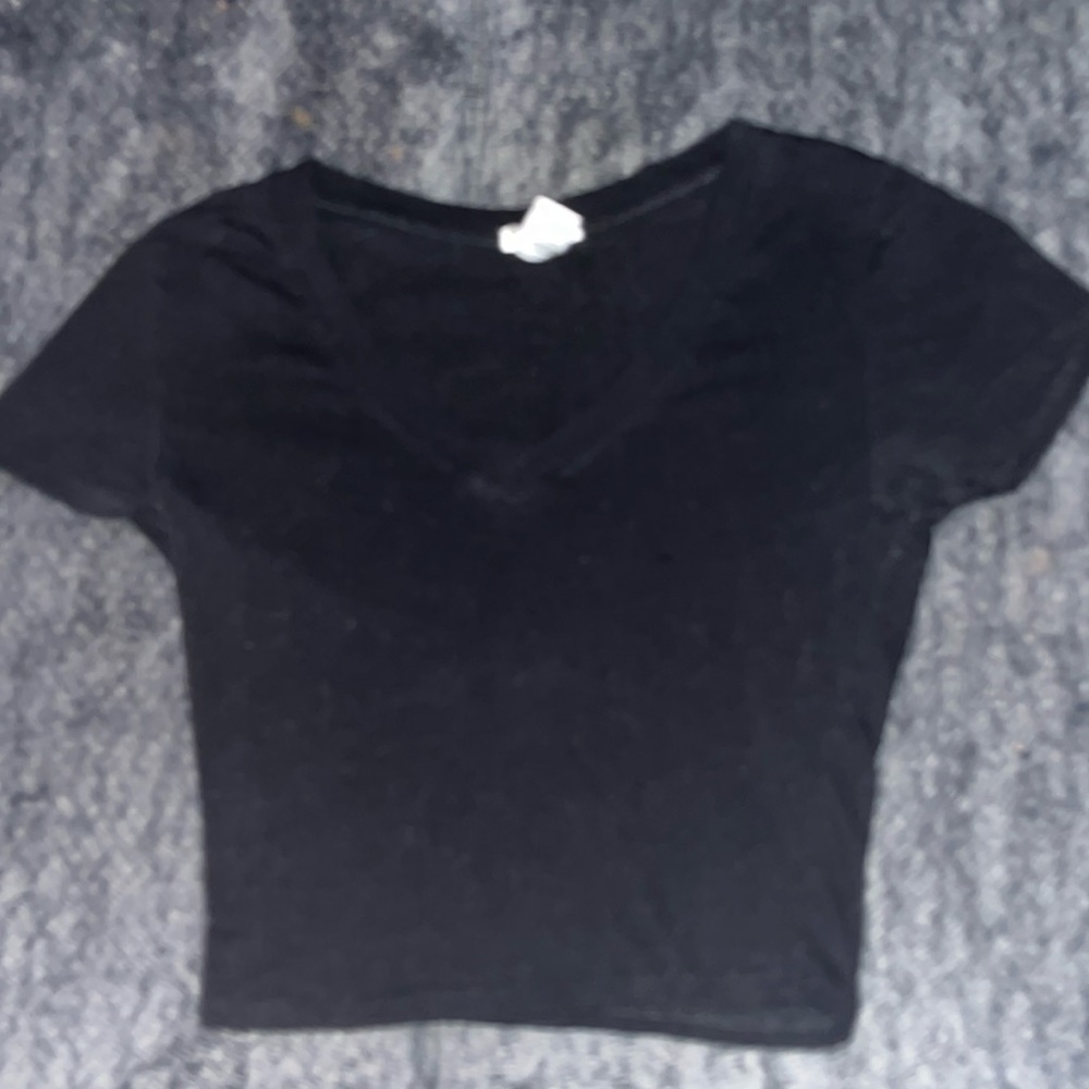 a lightly used croptop also a v-neck